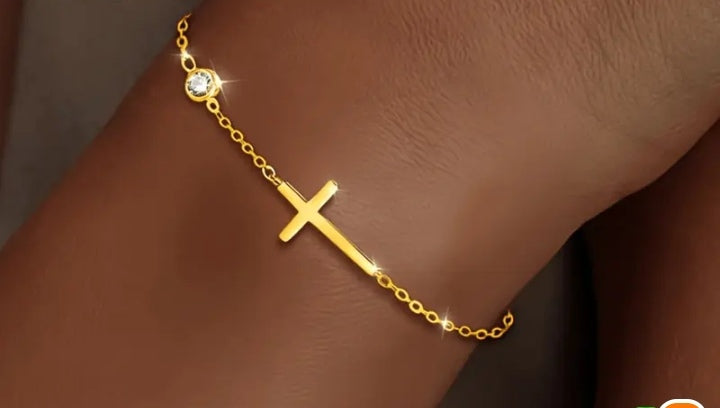 Gold-tone cross bracelet with clear stone detail from the Have a Little Faith collection