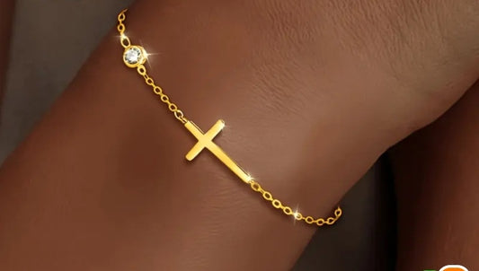 Gold-tone cross bracelet with clear stone detail from the Have a Little Faith collection