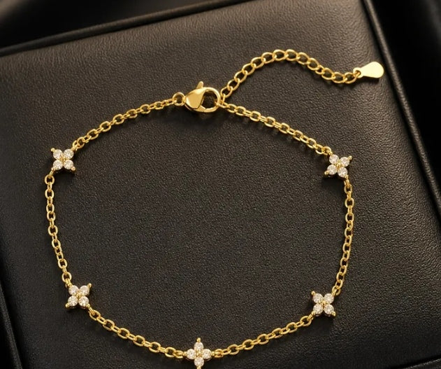 Gold-tone crystal clover bracelet from the Have a Little Faith collection